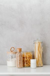 Kaboompics - Bright Minimal Pantry Still Life with Glass Food Jars and White Copy Space