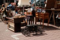 Kaboompics - Outdoor Flea Market Furniture Display with Vintage Tables and Decor