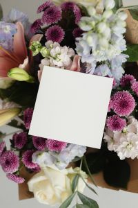 Kaboompics - Angled Blank Card among Lavender Flowers, Lilies and Purple Chrysanthemums