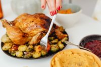 Kaboompics - Carving Roast Turkey with a Knife and Fork at Thanksgiving