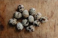 Kaboompics - Cluster of Quail Eggs on a Wooden Table