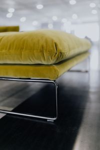 Kaboompics - Olive Velvet Seat Cushion and Slim Black Metal Chair Frame Close-Up