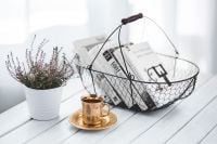 Kaboompics - Wire Book Basket with Potted Plant and Coffee on White Wood