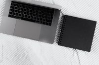 Kaboompics - MacBook and Black Spiral Notebook on White Marble, Modern Home Office Flat Lay