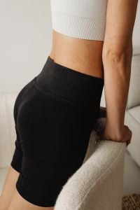 Kaboompics - Close-Up of a White Ribbed Crop Top and Dark Lounge Leggings