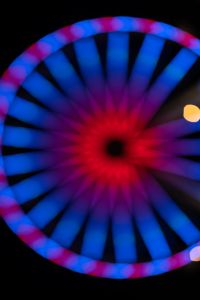 Kaboompics - Purple-Blue Ferris Wheel Rim with a Red Center Glow