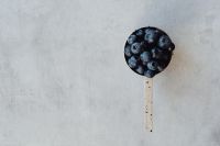 Kaboompics - Close-Up Wooden Scoop Filled with Blueberries