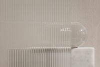 Kaboompics - Glass Sphere Behind Ribbed Glass Panel