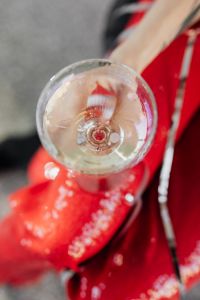 Kaboompics - Top-Down Champagne Glass and Sequined Red New Year Outfit