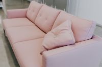 Kaboompics - Pale Pink Contemporary Sofa with Tufted Cushions in a Bright Showroom