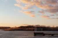 Kaboompics - Wooden Dock on a Frozen Lake Beneath Pastel Clouds