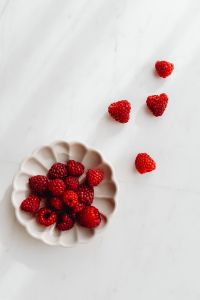 Kaboompics - Flower Dish Of Raspberries With Scattered Berries