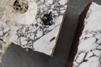 Kaboompics - Marble Side Table with Textured Ceramic Vase and Black Figurine