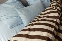 Kaboompics - Brown Striped Duvet and Blue Bedding Bedroom Detail