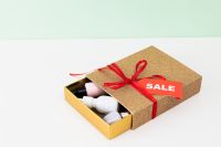Kaboompics - Open Gift Box with Beauty Products and Sale Tag