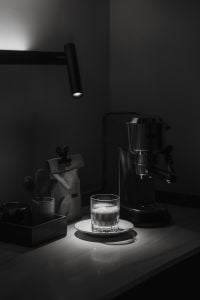 Kaboompics - Moody Espresso Machine with Foamy Coffee in a Glass