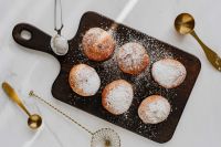 Kaboompics - Overhead Polish Pączki with Brass Spoon and Mesh Skimmer