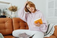 Kaboompics - Woman uses laptop - working from home - reading a book