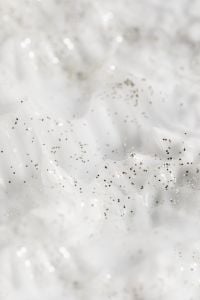 Kaboompics - Soft-Focus White Cream with Scattered Dark Speckles and Glossy Bokeh Highlights