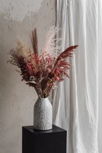 Kaboompics - Pink And Neutral Dried Flower Arrangement In Sculptural White Vase