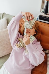 Kaboompics - Woman counts money - dollars - currency - bill