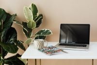Kaboompics - Wide Marble Desk with Laptop, Coffee and Colorful Notebook