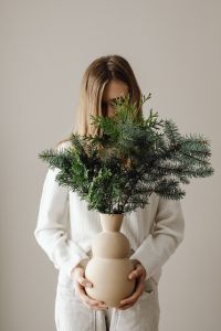 Kaboompics - Woman Holding a Love Candle in a White Sweater