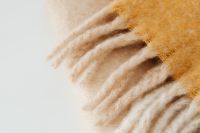 Kaboompics - Folded Yellow Fringed Blanket Close-Up