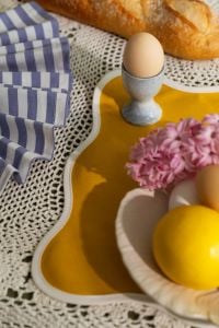 Kaboompics - Easter Egg in Ceramic Cup with Blue Check Napkin, Baguette and Hyacinth