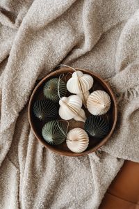 Kaboompics - Bowl of Handmade Paper Ornaments on Blanket