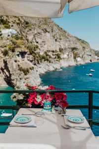 Kaboompics - Cafe Table Under a Beach Umbrella with Amalfi Coast Views