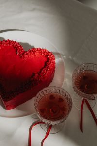 Kaboompics - Close-Up Heart Cake and Red Cocktails with Ribbon Bows