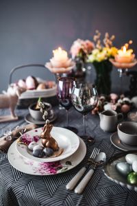 Round dinner table decorated with easter motifs