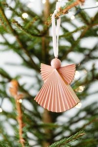 Kaboompics - Peach Angel Ornament with Christmas Tree Bokeh