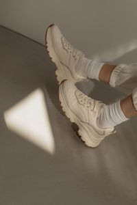 Kaboompics - White Sneakers and Neutral Joggers Close-Up