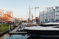 Kaboompics - Gdańsk Marina with Yachts, Modern Waterfront Buildings and Construction Cranes