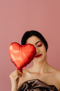 Kaboompics - Beauty Portrait With Red Heart Balloon Over One Eye