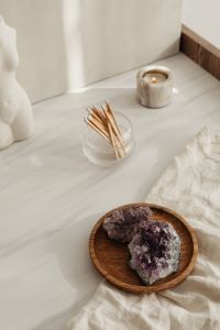 Kaboompics - Torso Vase With Candle And Amethyst On Wood Tray