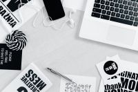 Kaboompics - Top View of Laptop, Phone, Earphones and Typography Cards
