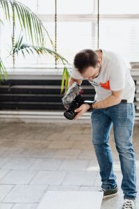 Kaboompics - Filmmaker with DSLR Camera Taking Shoots