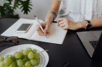 Kaboompics - Professional Woman Writing Notes at an Office Desk