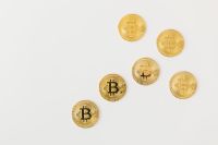 Kaboompics - Scattered Bitcoin Coins on White Background