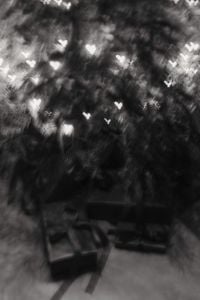 Kaboompics - Black and White Christmas Tree Bokeh with Wrapped Gifts