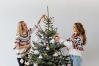 Kaboompics - Two Women Decorating a Christmas Tree with Holiday Ornaments
