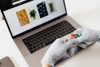 Kaboompics - Gloved Hands Holding Bank Card During Online Shopping