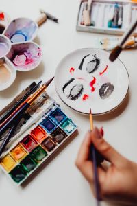 Kaboompics - A woman paints with watercolors
