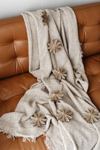 Kaboompics - Cozy Sofa with Wooden Snowflake Christmas Decorations