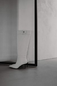 Kaboompics - White Knee-High Boot by Black Glass Frame