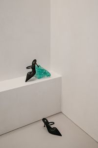 Kaboompics - Black Pointed Heel with Turquoise Fabric on White Ledge