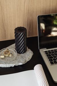 Kaboompics - Black Candle and Laptop on Wooden Desk, Neutral Home Office with Gold Clips